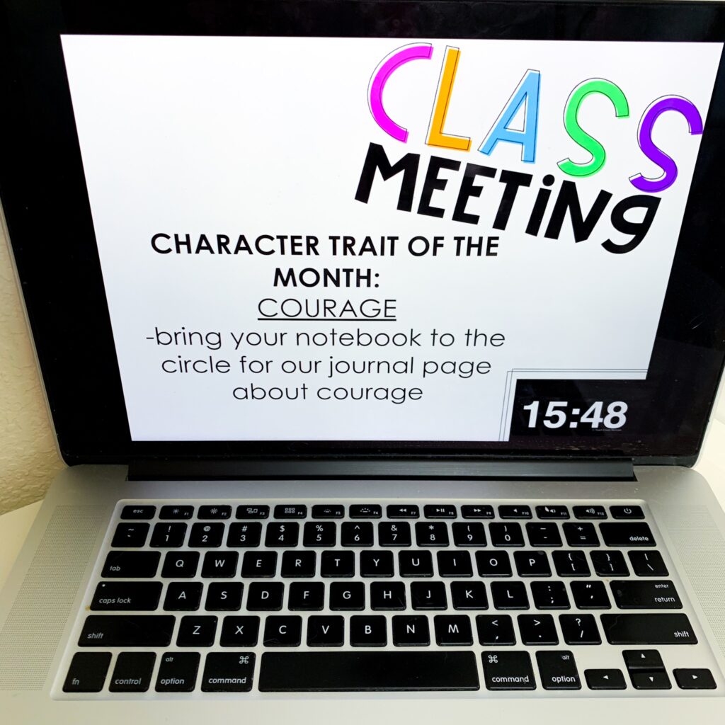 Picture of an open laptop displaying a Class Meeting slide